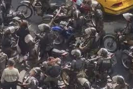 A grab from the video in which security forces harassed a female protester