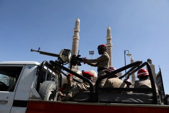 Military policemen ride on the back of a patrol truck at the site of a funeral of Houthi fighters killed during fighting against government forces, in Sanaa, Yemen December 6, 2021.