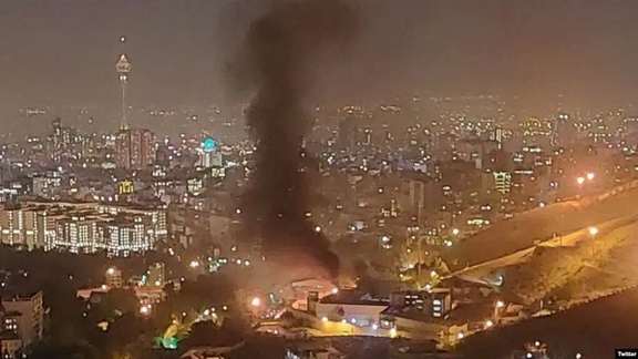 Tehran's notorious Evin Prison with fires burning inside the sprawling complex on October 15, 2022