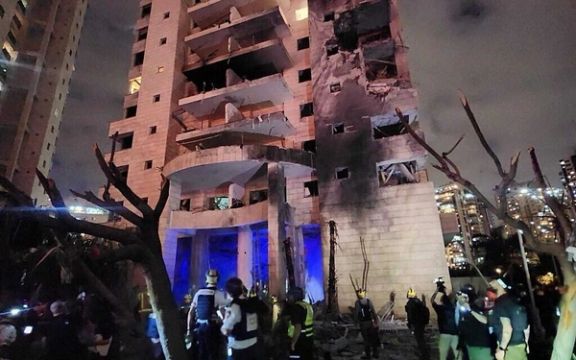 Magen David Adom paramedics attend to the site of an Iranian ballistic missile attack in Petah Tikva in central Israel, June 16, 2025.