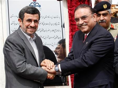 Iran's former president Mahmoud Ahmadinejad (left) shaking hands with his Pakistani counterpart Asif Ali Zardari, during a groundbreaking ceremony to mark the start of construction of the Iran-Pakistan gas pipeline, in the city of Chabahar in southeastern Iran March 11, 2013  