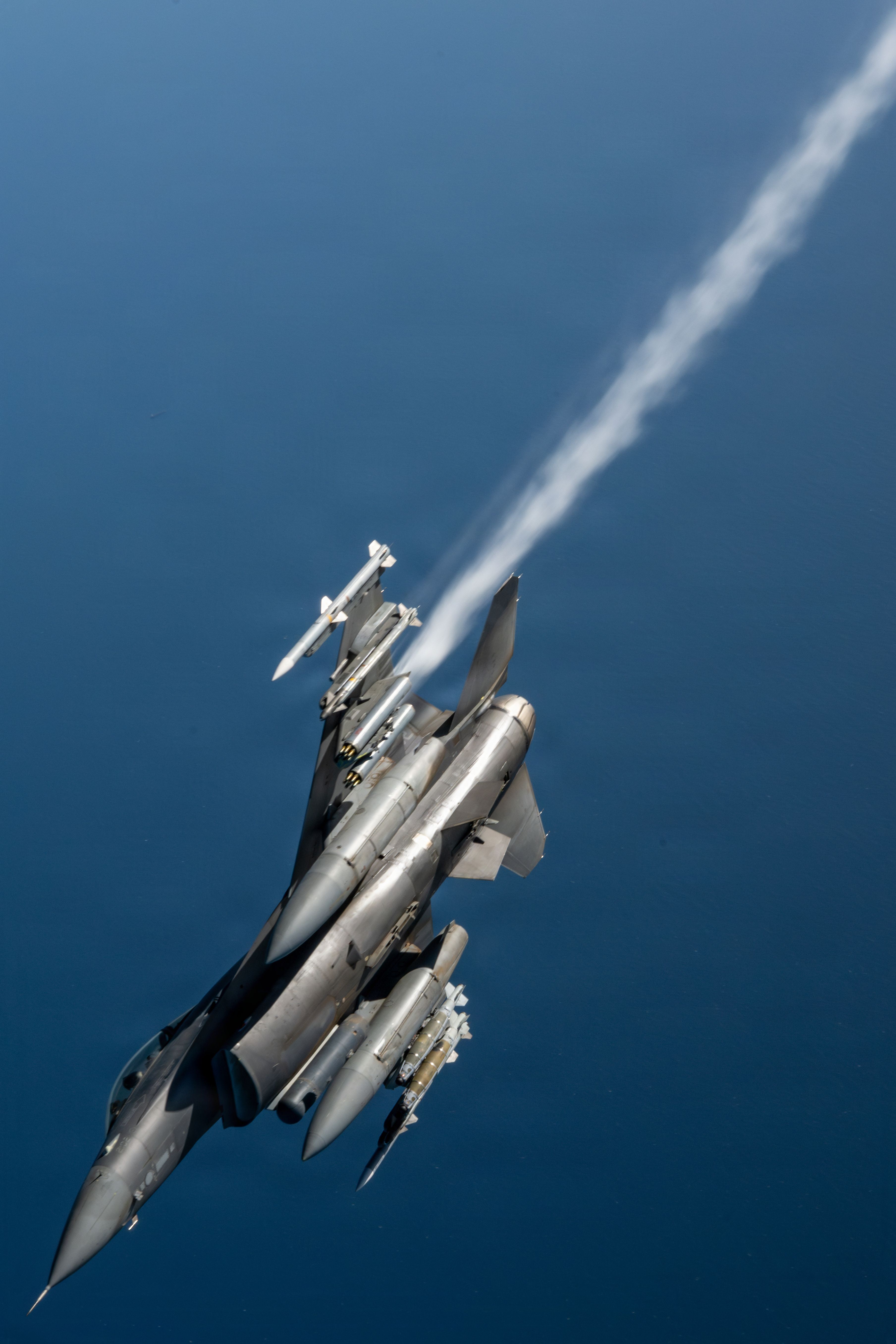 A US Air Force F-16 Fighting Falcon flies away from the boom of a KC-135 Stratotanker in the US Central Command area of responsibility May 23, 2026. (US Air Force photo by Tech Sgt Tiffany A. Emery)