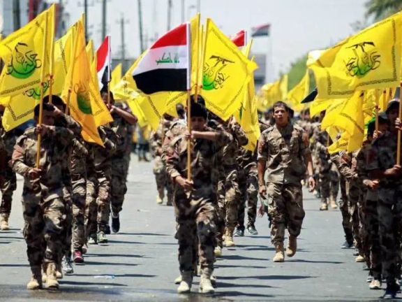 Iraqi Shiite Muslims from the Popular Mobilization Units (Hashd al-Shaabi) march during a parade marking the annual Quds Day, or Jerusalem Day, in Baghdad, Iraq, June 23, 2017.