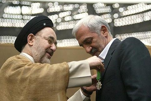 Former President of Iran’s Football Federation Mohammad Dadkan receiving a medal from former president Mohammad Khatami