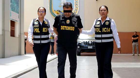 Majid Azizi, an alleged member of Iran's Quds Force in the custody of Peruvian police. March 2024