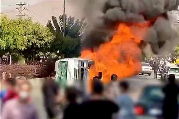 Protesters set fire to a police vehicle in Karaj, west of Tehran on November 3, 2022