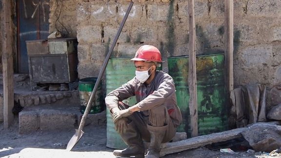 An Iranian worker in the capital Tehran