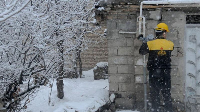 An Iranian gas technician working in freezing conditions as the country grapples with energy shortages. (undated)