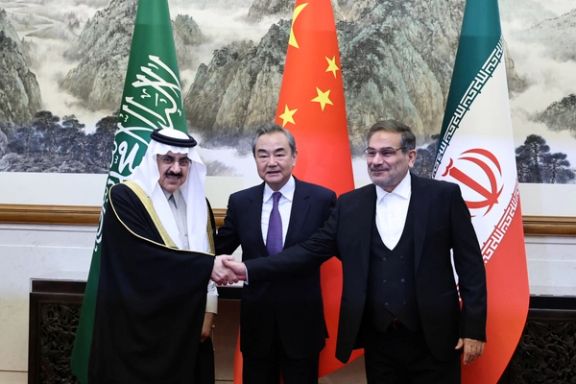 China's Wang Yi, Iran's Ali Shamkhani, Saudi Arabia's Musaad bin Mohammed Al Aiban pose for pictures during a meeting in Beijing, China March 10, 2023.