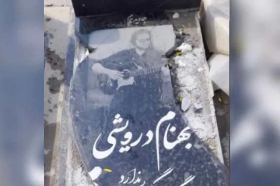 The damaged gravestone of Behnam Darvishi, a slain protestor killed during Iran's nationwide January 2026 protests, is seen after being broken and defaced.