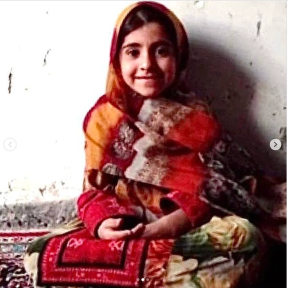 Seven-year-old Hasti Narouei in traditional Baluchi dress