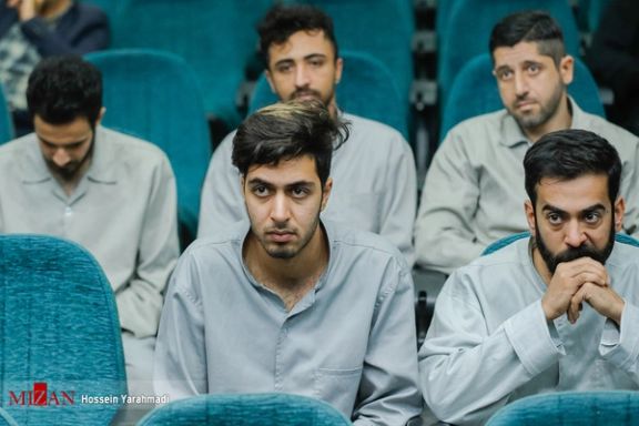 Detained protesters during a court session for Ruhollah Ajamian, a Basij agent who was killed during Iran protests