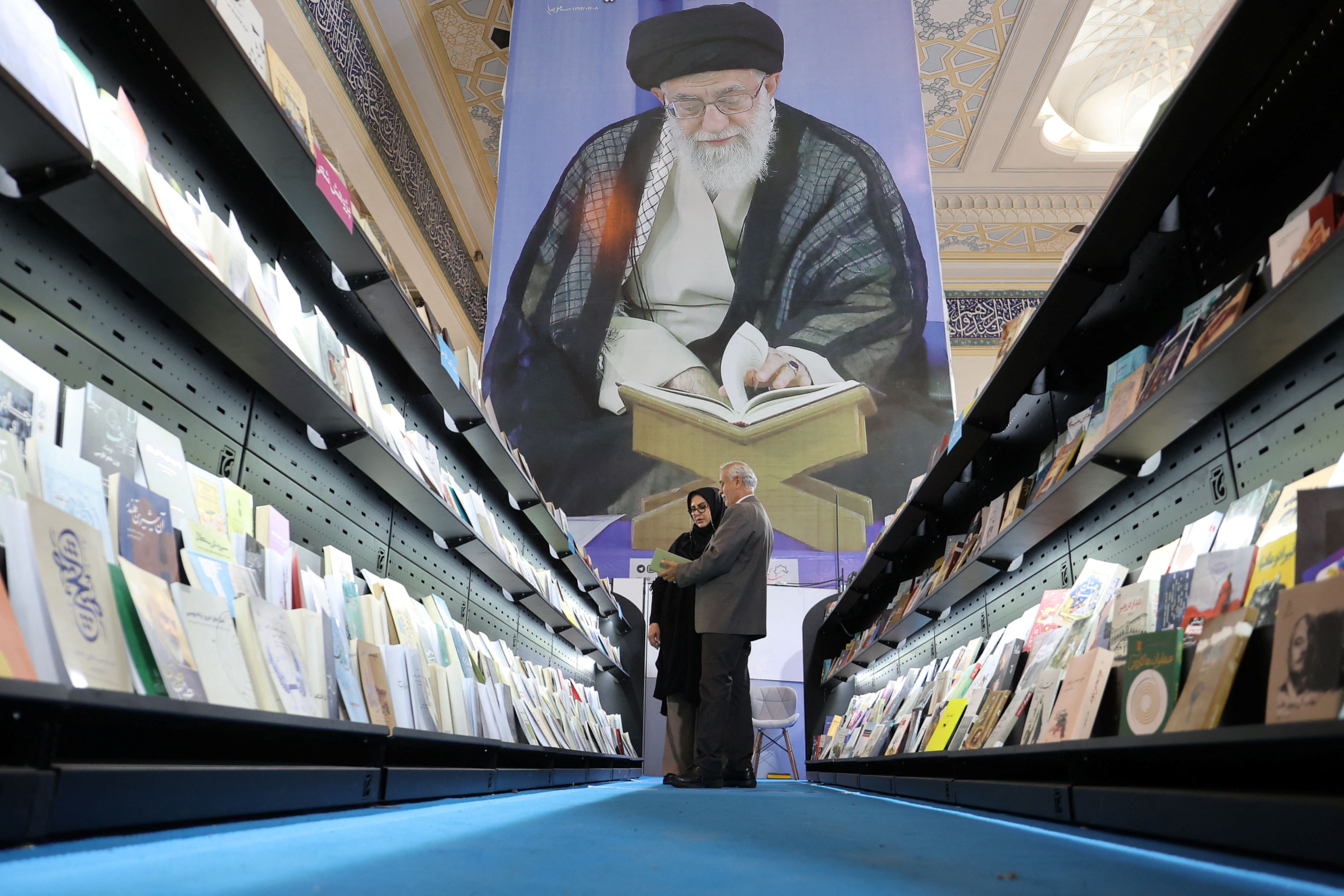  People look at books during the International Book Fair in Tehran, Iran, May 13, 2024.