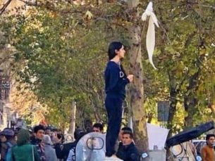 Vida Movahed protesting against compulsory hijab in Tehran in December 2017