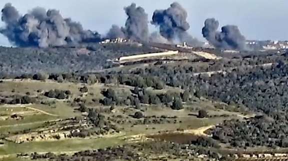 Smoke rises following what the Israeli military says is an Israeli strike on Hezbollah targets in a location given as Lebanon, amid the ongoing cross-border hostilities between Hezbollah and Israeli forces, on December 20, 2023.