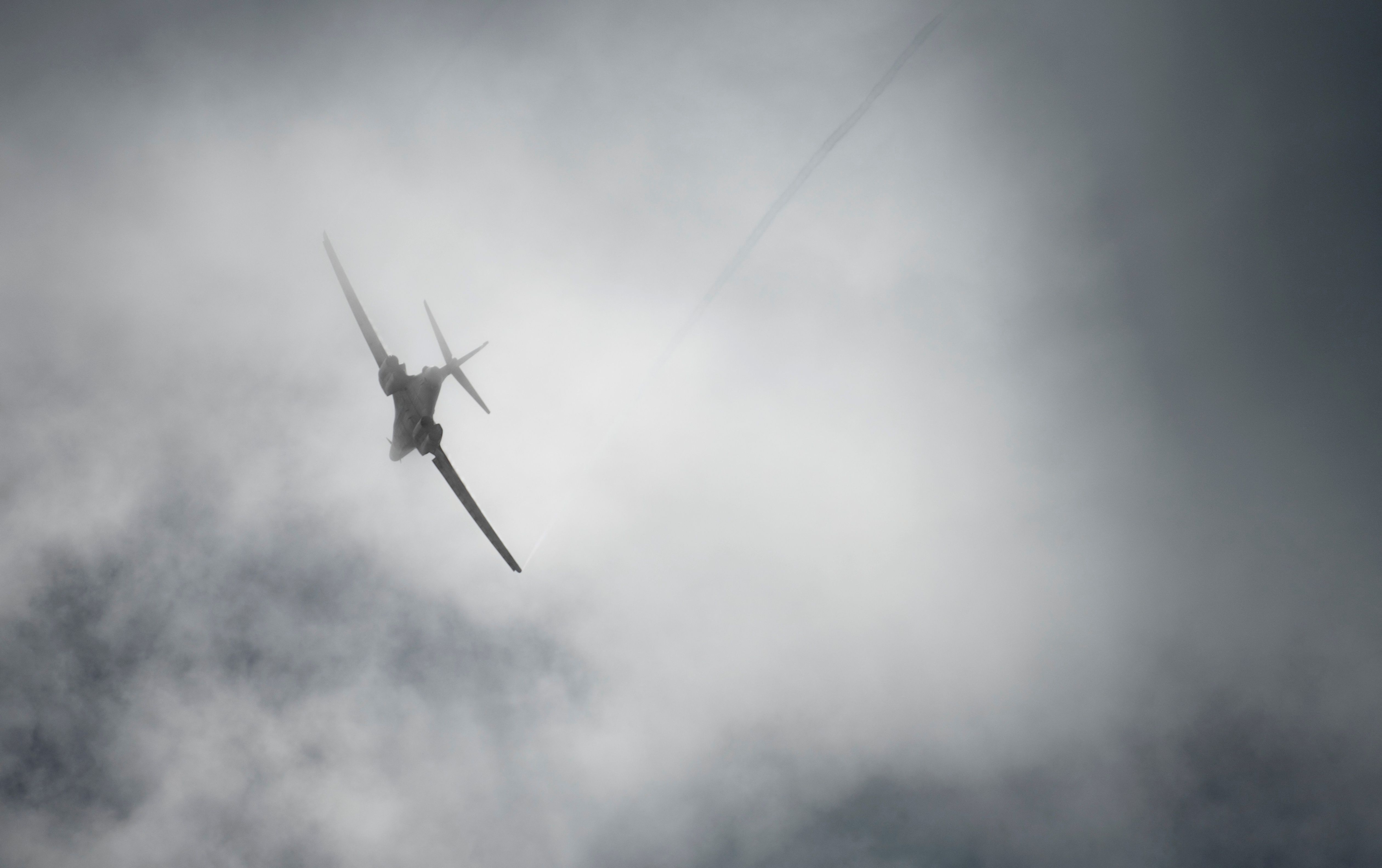 A US Air Force B-1B Lancer bomber flies through a cloud over Andersen Air Force Base, Guam May 19, 2020. 