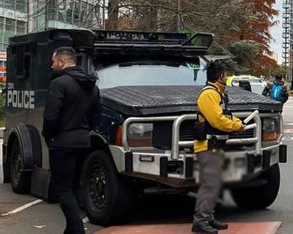 Police special vehicles parked outside Iran International headquarters in London, on November 16, 2022