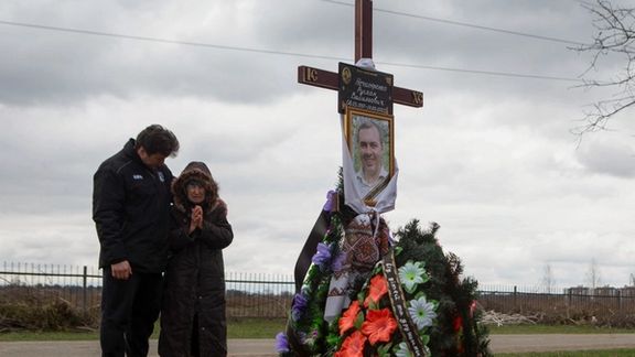 At the grave of a man killed in Bucha, Ukraine. April 18, 2022
