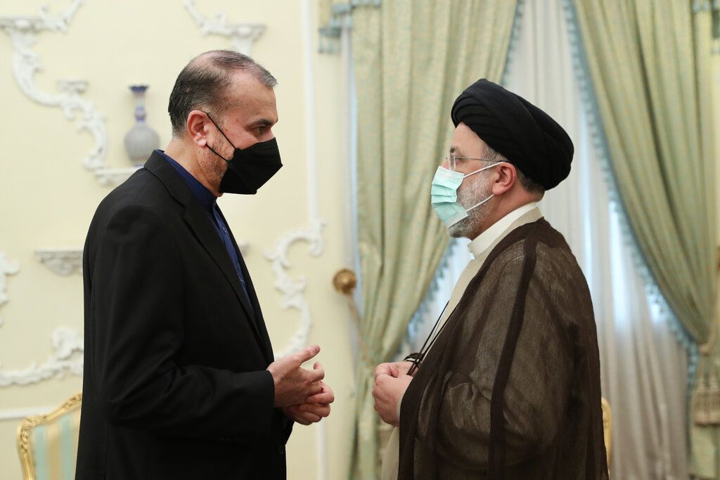 President Ebrahim Raisi (R) with foreign minister Hossein Amir-Abdollahian