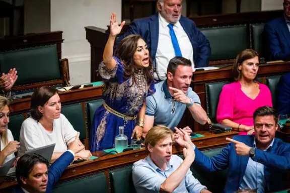 Darya Safai (center) reacts during a plenary session of the Chamber at the Federal Parliament in Brussels in June 2023.
