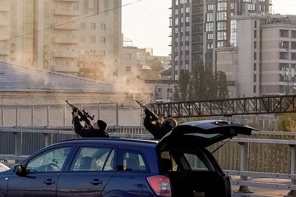 Ukrainian policemen firing at Iranian drones over Kyiv on October 17, 2022