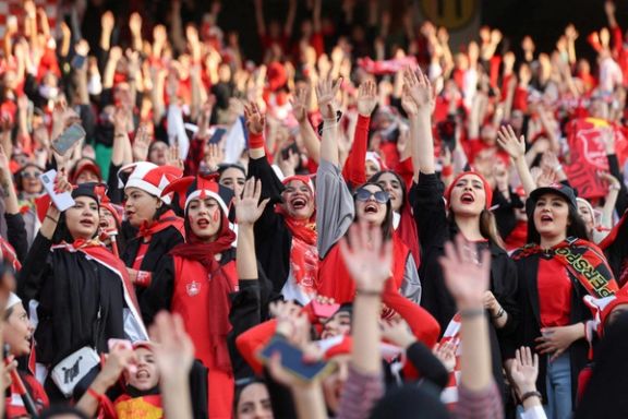 Persepolis soccer team fans gesture at a Persepolis v Sanat Naft-e Abadan match in Iran's Premier League at Azadi stadium in Tehran, Iran August 31, 2022
