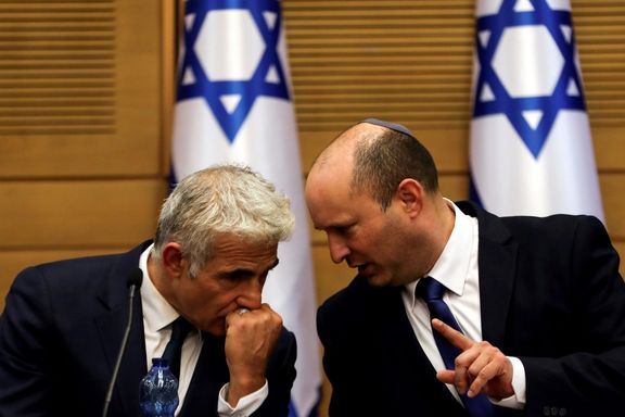 Israeli foreign minister Yair Lapid (L) and PM Naftali Bennett.