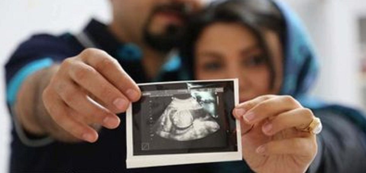 As Iranian couple holding an ultrasound picture of their baby (file photo)