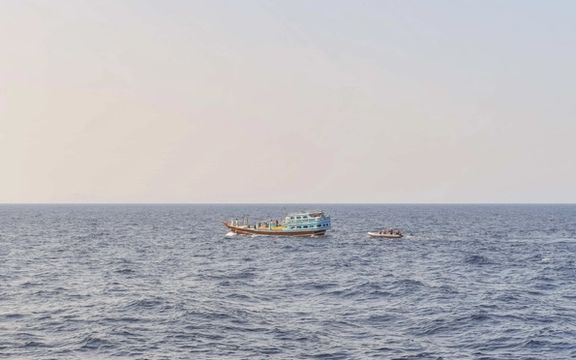 US naval forces approach a fishing vessel transiting international waters in the Gulf of Oman during an interdiction. (November 2022)