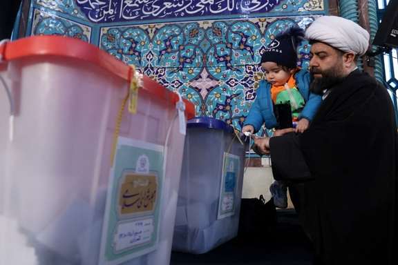 A cleric seen voting in Iran's March 1 elections.