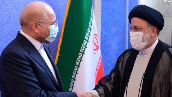 Parliament Speaker Mohammad Bagher Ghalibaf shaking hands with President Ebrahim Raisi