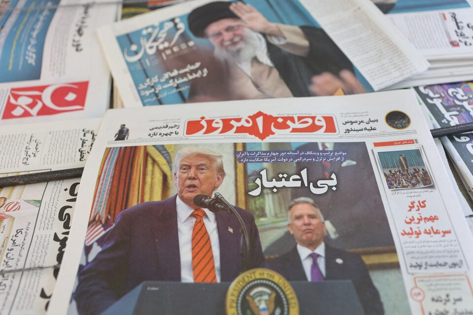 An Iranian newspaper with a cover photo of US President Donald Trump and US Middle East envoy Steve Witkoff, is seen in Tehran, Iran, May 11, 2025.
