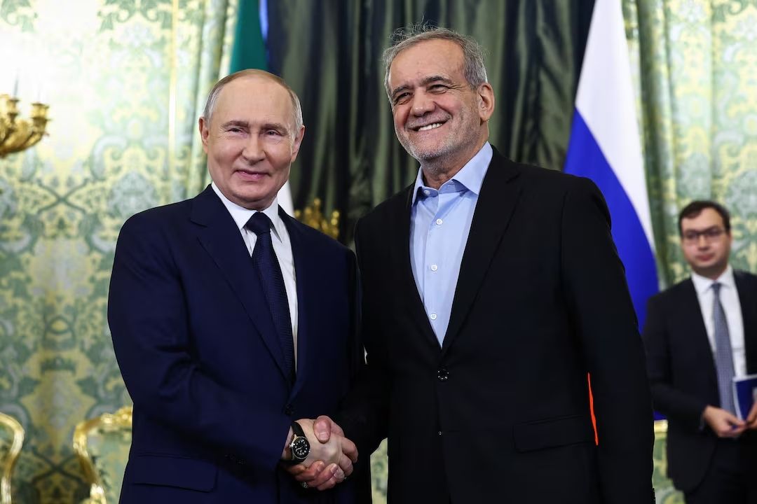 Russian President Vladimir Putin and Iranian President Masoud Pezeshkian shake hands as they meet in Moscow, Russia January 17, 2025.