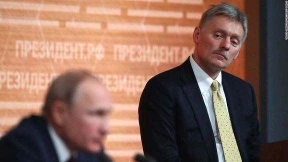 Dmitry Peskov alongside Russian President Vladimir Putin.