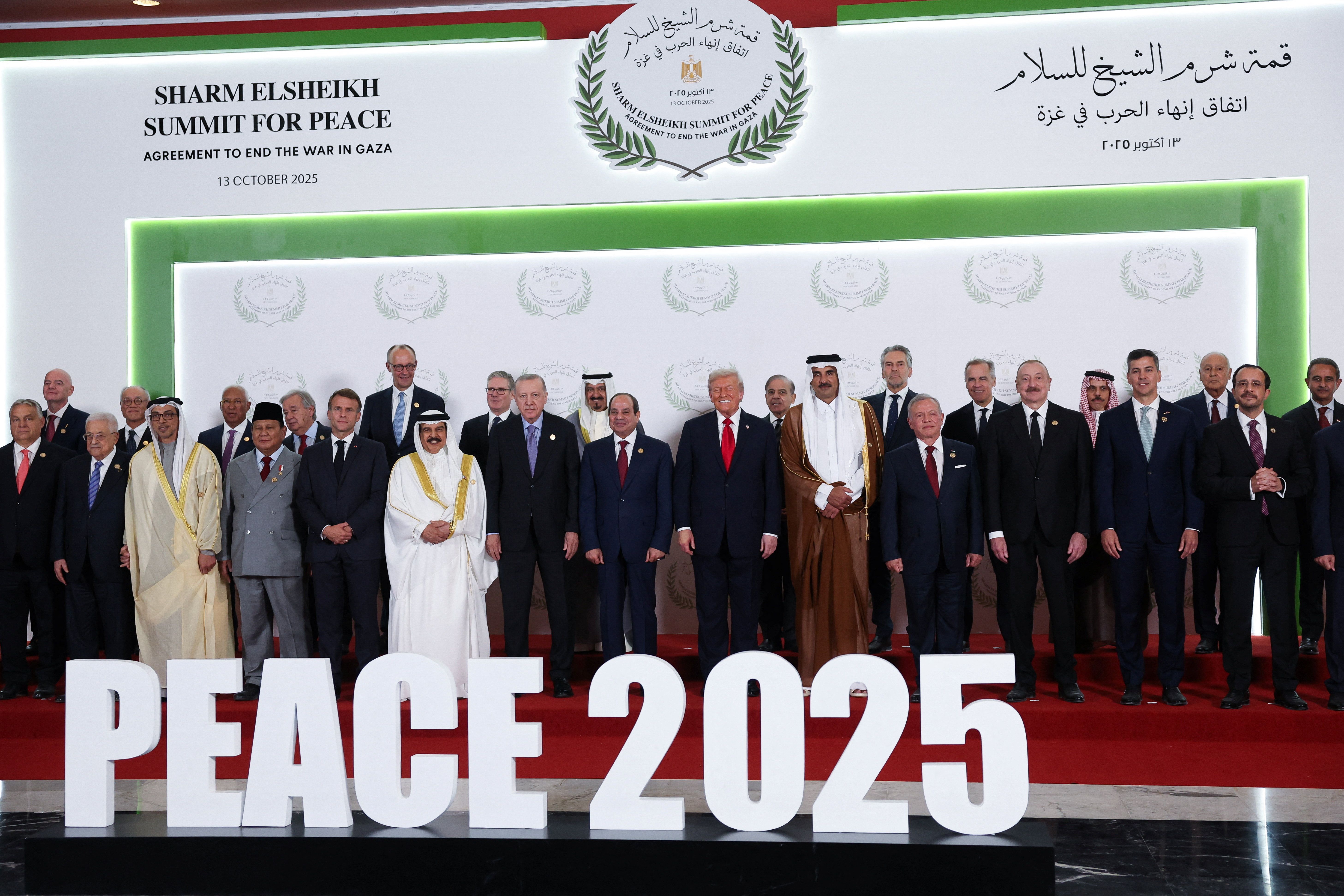 World leaders pose for a family photo, at a world leaders' summit on ending the Gaza war, in Sharm el-Sheikh, Egypt, October 13, 2025.