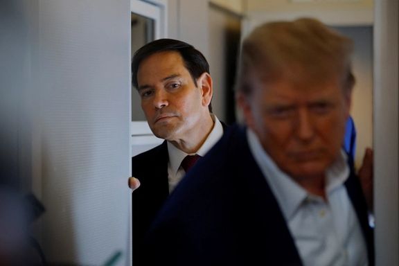 US Secretary of State Marco Rubio listens as President Donald Trump speaks to reporters onboard Air Force One en route to the NATO summit in The Hague, Netherlands, June 24, 2025.