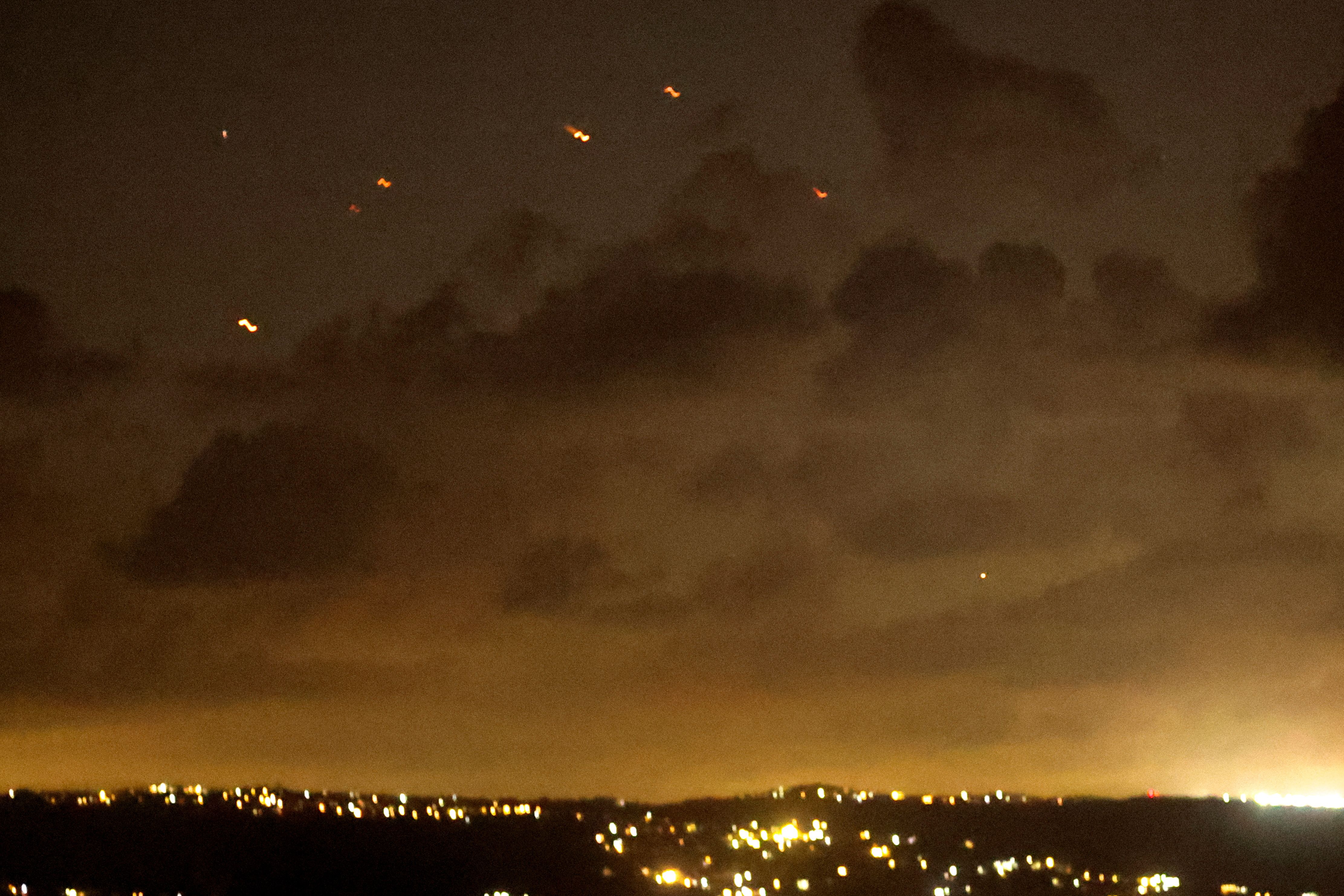 Projectiles fly in the sky after Iran fired a salvo of ballistic missiles at Israel, as seen from southern Lebanon, October 1, 2024
