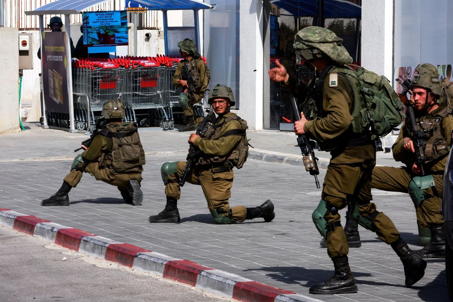 Israeli soldiers work to secure residential areas following a mass-infiltration by Hamas gunmen from the Gaza Strip, in Sderot, southern Israel, October 7. 
