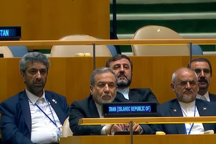Iranian Foreign Minister Abbas Araghchi listens to Pezeshkian's speech.