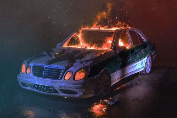 An artwork created in support of protests in the last week of the Iranian year showing a police car on fire