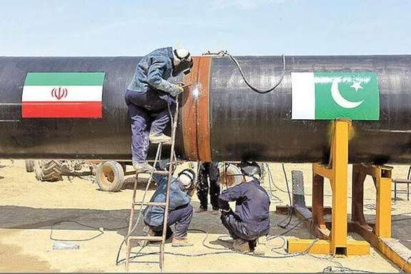 Welders working on a part of Iran-Pakistan pipeline