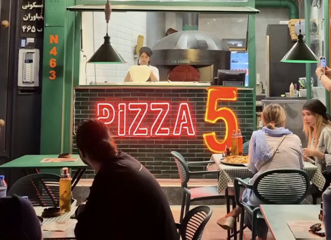 Dollar-pegged pizza in Tehran points to a different kind of regime change