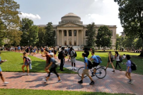 Students walk past Wilson Library on the campus of the University of North Carolina at Chapel Hill, North Carolina, September 20, 2018.