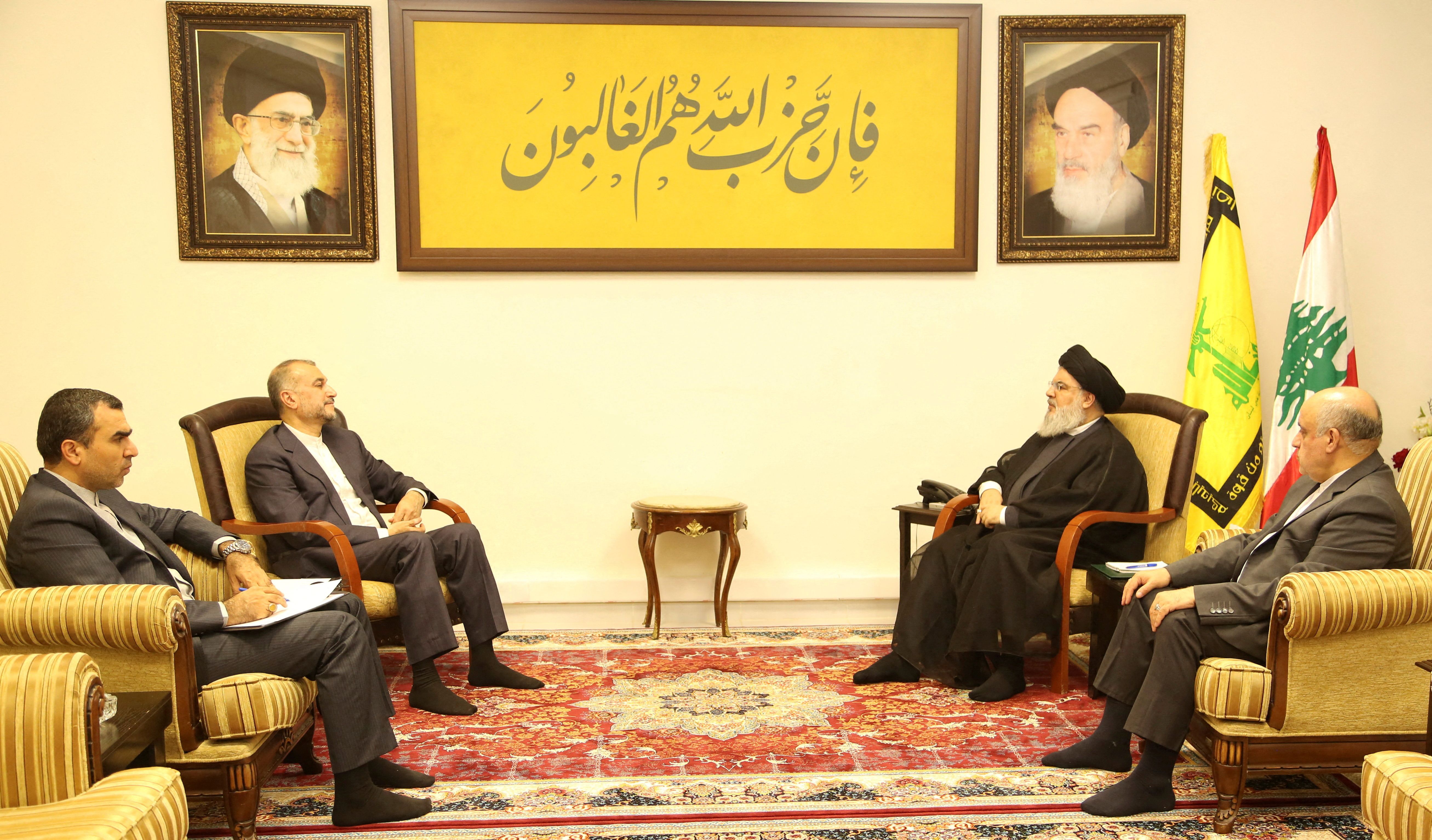 Lebanon's Hezbollah leader Sayyed Hassan Nasrallah meets with Iranian Foreign Minister Hossein Amirabdollahian in this handout picture released on October 13, 2023, Lebanon.