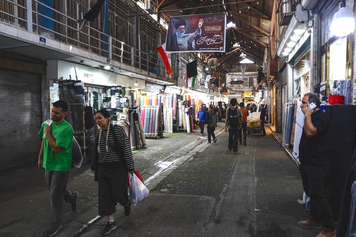 People walk in Tehran's Grand Bazaar, April 2026