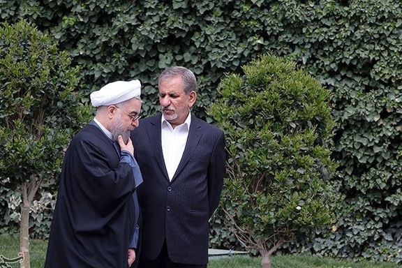 Es'haq Jahangiri speaking with former President Hassan Rouhani. Undated