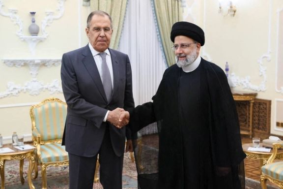 Russian Foreign Minister Sergei Lavrov shakes hands with Iranian President Ebrahim Raisi during a meeting in Tehran, Iran October 23, 2023.