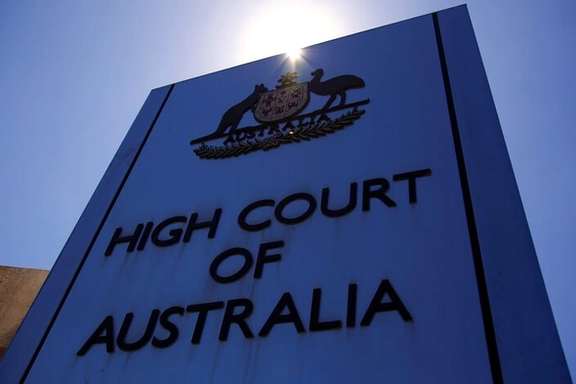 A sign is seen outside the main entrance to the High Court of Australia building in Canberra, Australia, October 16, 2017.