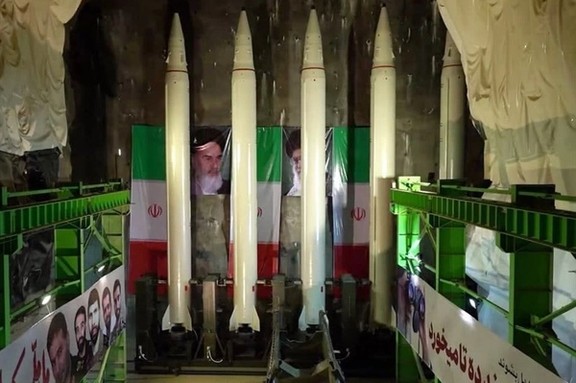 Iranian missiles with images of Islamic Republic leaders in the background