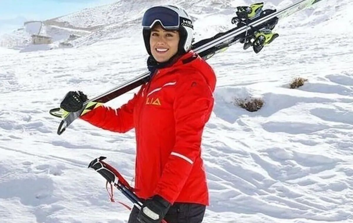 Iranian skier who had fled to Germany makes homecoming, praises Khamenei